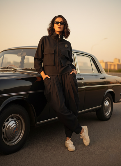 Black Draped pants & Black Shirt Jacket worn by a model, highlighting organic cotton, sustainable and soft breathable design.